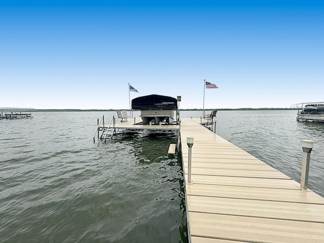 25797 Silver Beach Rd, Minnewaska Twp, MN 56334 - dock area with boat lift and a water view