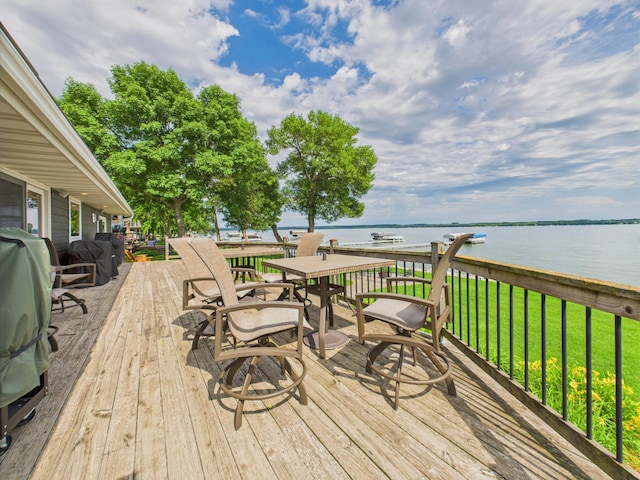 25797 Silver Beach Rd, Minnewaska Twp, MN 56334 - deck with a water view, a yard, and outdoor dining space