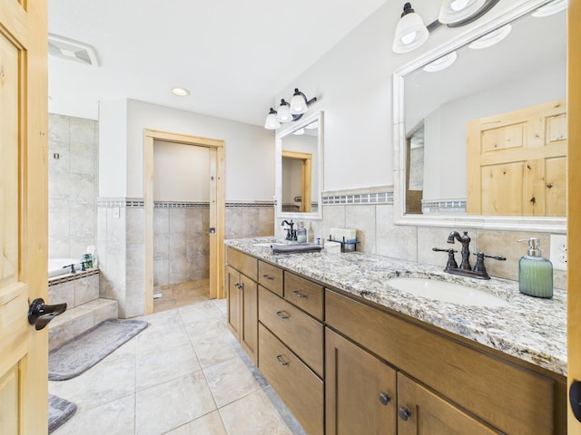 25797 Silver Beach Rd, Minnewaska Twp, MN 56334 - full bathroom featuring tile walls, double vanity, tiled tub, tiled shower, and tile patterned floors