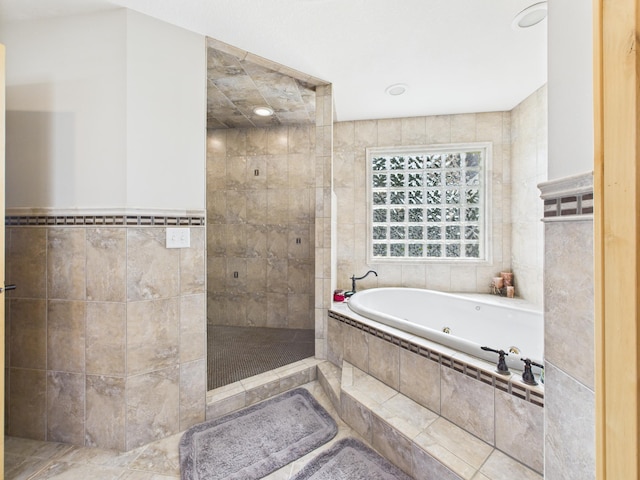 25797 Silver Beach Rd, Minnewaska Twp, MN 56334 - full bathroom featuring tile walls, a tub with jets, and walk in shower