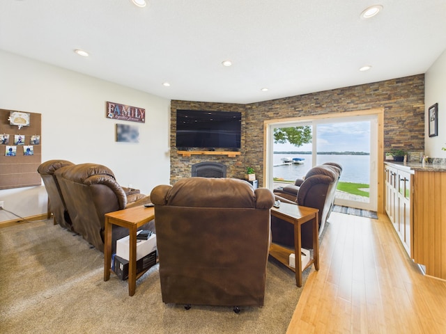 25797 Silver Beach Rd, Minnewaska Twp, MN 56334 - living area with recessed lighting, a large fireplace, and light wood-style floors