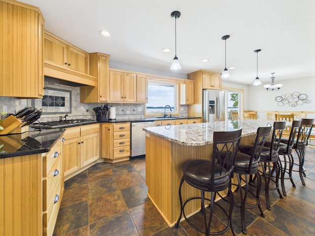 25797 Silver Beach Rd, Minnewaska Twp, MN 56334 - kitchen with appliances with stainless steel finishes, light brown cabinetry, healthy amount of natural light, stone tile floors, and recessed lighting