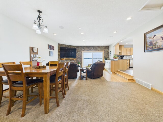 25797 Silver Beach Rd, Minnewaska Twp, MN 56334 - dining space with light carpet, arched walkways, and recessed lighting
