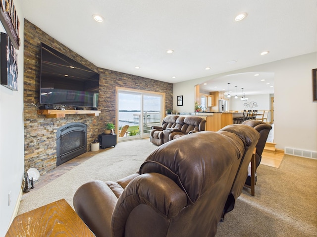 25797 Silver Beach Rd, Minnewaska Twp, MN 56334 - living area featuring light colored carpet, recessed lighting, and a large fireplace