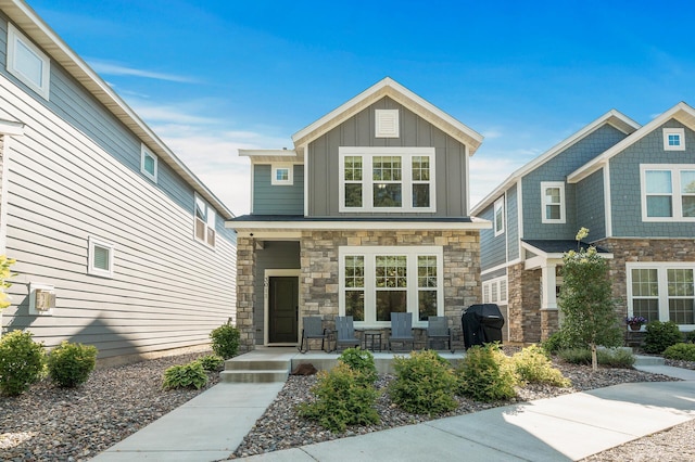 3011 Rum River Way, Anoka, MN 55303 - craftsman inspired home featuring covered porch, stone siding, and board and batten siding