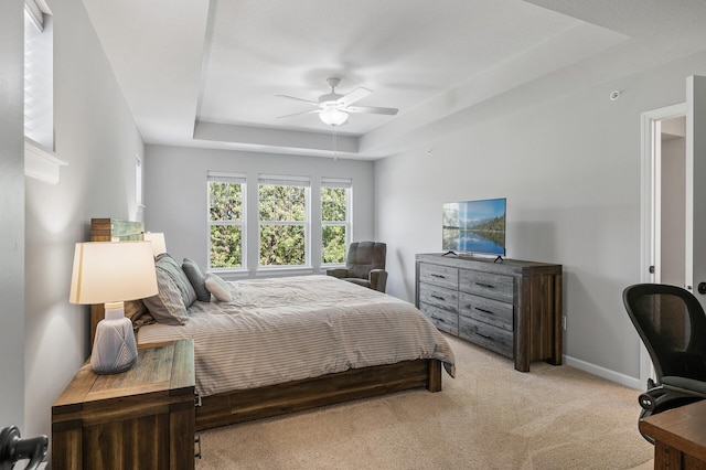 3011 Rum River Way, Anoka, MN 55303 - bedroom featuring a raised ceiling, carpet flooring, a ceiling fan, and baseboards