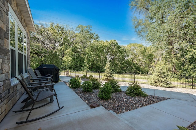 3011 Rum River Way, Anoka, MN 55303 - view of patio / terrace featuring a grill and view of wooded area