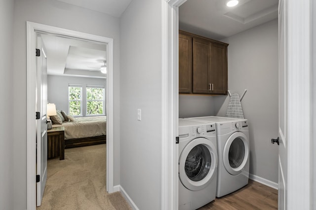 3011 Rum River Way, Anoka, MN 55303 - laundry room featuring cabinet space, washing machine and dryer, baseboards, and a ceiling fan