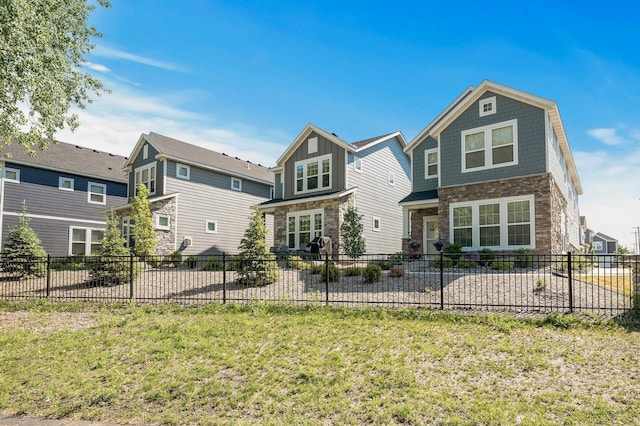 3011 Rum River Way, Anoka, MN 55303 - rear view of house featuring stone siding and a patio
