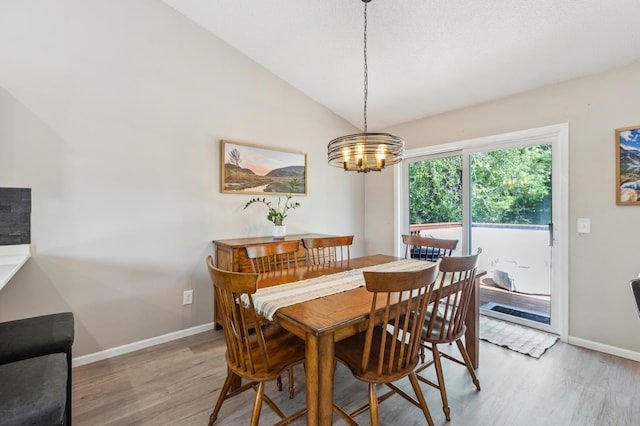 805 Natalie Dr, Buffalo, MN 55313 - dining room featuring light wood-style floors, baseboards, a chandelier, and lofted ceiling