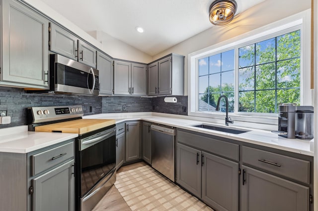 805 Natalie Dr, Buffalo, MN 55313 - kitchen with appliances with stainless steel finishes, gray cabinets, a sink, light countertops, and recessed lighting