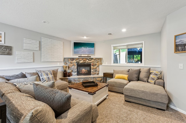 805 Natalie Dr, Buffalo, MN 55313 - living room with a textured ceiling, a stone fireplace, light colored carpet, recessed lighting, and baseboards