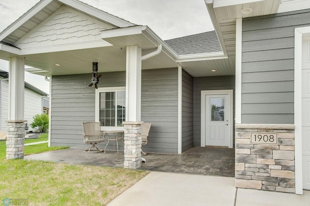 1908 65th Ave S, Fargo, ND 58104 - entrance to property featuring covered porch and roof with shingles