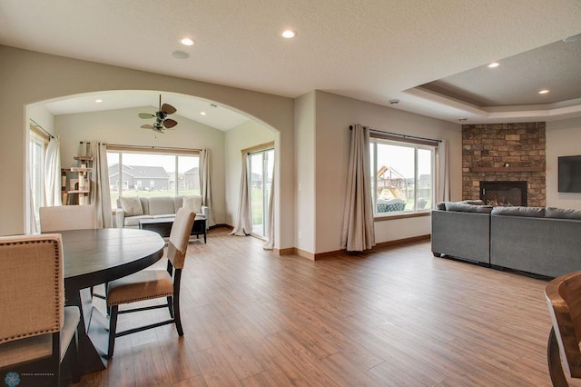 1908 65th Ave S, Fargo, ND 58104 - dining room with arched walkways, wood finished floors, plenty of natural light, baseboards, and lofted ceiling