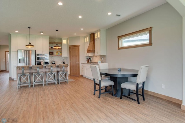1908 65th Ave S, Fargo, ND 58104 - dining space with light wood-style flooring, recessed lighting, and baseboards