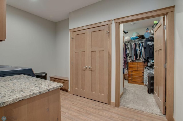 1908 65th Ave S, Fargo, ND 58104 - bedroom with a walk in closet, a closet, light wood-style floors, and baseboards
