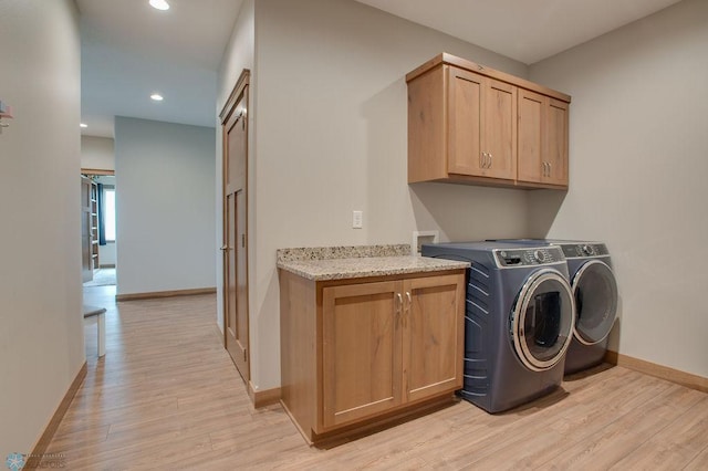 1908 65th Ave S, Fargo, ND 58104 - washroom with cabinet space, light wood-style flooring, baseboards, separate washer and dryer, and recessed lighting
