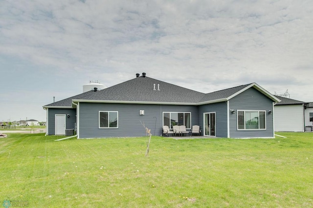 1908 65th Ave S, Fargo, ND 58104 - back of property with a yard and a patio
