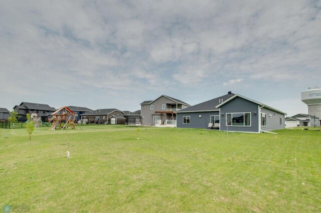 1908 65th Ave S, Fargo, ND 58104 - view of yard featuring a playground and a residential view