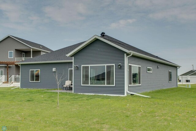 1908 65th Ave S, Fargo, ND 58104 - rear view of property with a yard
