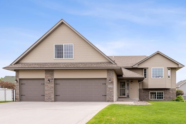 30259 Fox Run Rd, Stacy, MN 55079 - view of front facade featuring roof with shingles, concrete driveway, stone siding, and an attached garage