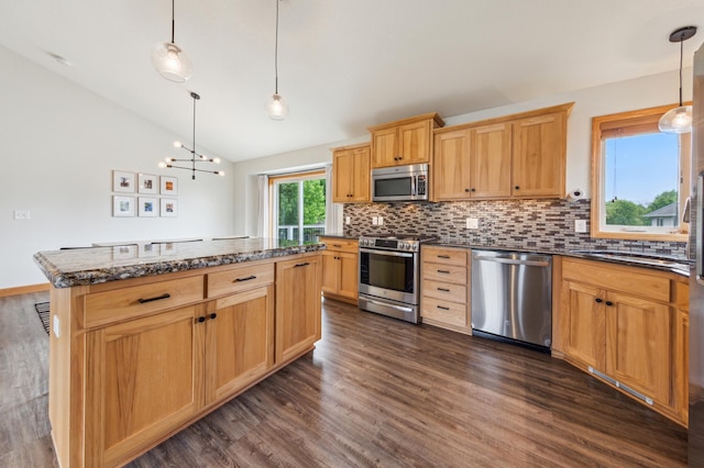 30259 Fox Run Rd, Stacy, MN 55079 - kitchen featuring stainless steel appliances, dark wood-style floors, vaulted ceiling, decorative backsplash, and a chandelier