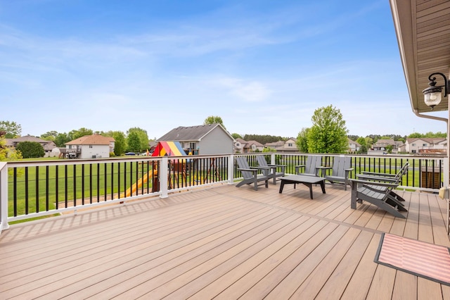 30259 Fox Run Rd, Stacy, MN 55079 - wooden deck featuring a residential view, a lawn, and a playground