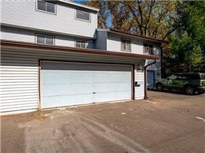 4819 Grenwich Way N, Oakdale, MN 55128 - garage featuring driveway