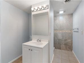 4819 Grenwich Way N, Oakdale, MN 55128 - full bath with vanity, a tile shower, baseboards, and tile patterned floors