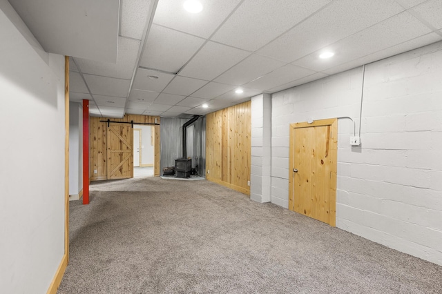 469 Little Canada Rd E, Little Canada, MN 55117 - finished basement with carpet, a wood stove, recessed lighting, a barn door, and baseboards