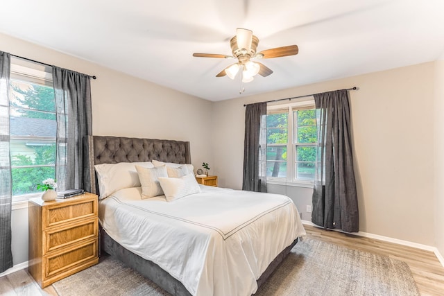 5725 Golden Valley Rd, Golden Valley, MN 55422 - bedroom with light wood-style floors, baseboards, and ceiling fan