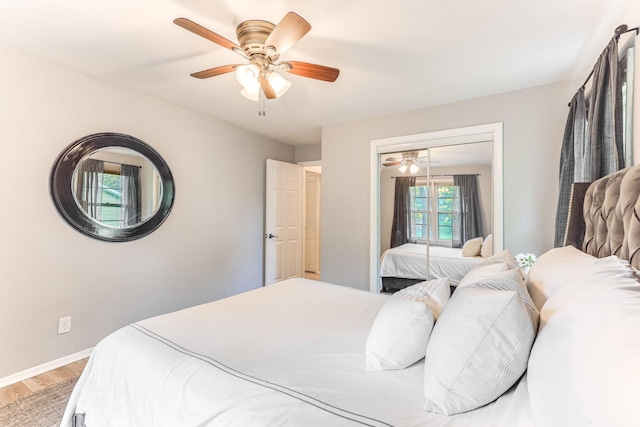 5725 Golden Valley Rd, Golden Valley, MN 55422 - bedroom with light wood-style floors, baseboards, ceiling fan, and a closet