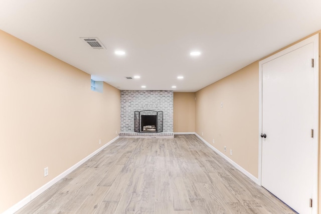 5725 Golden Valley Rd, Golden Valley, MN 55422 - unfurnished living room featuring light wood finished floors, recessed lighting, a brick fireplace, and baseboards