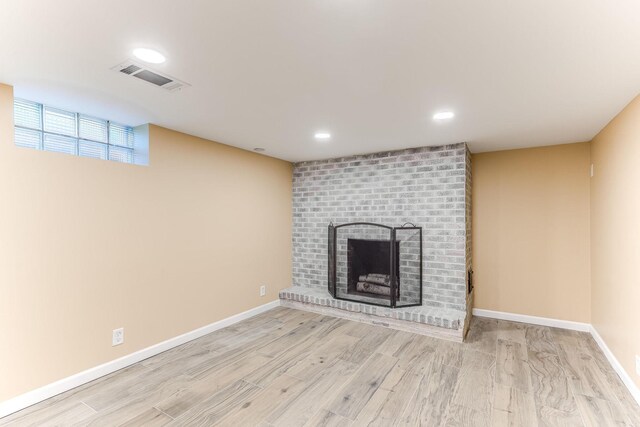 5725 Golden Valley Rd, Golden Valley, MN 55422 - unfurnished living room with a fireplace, baseboards, wood finished floors, and recessed lighting