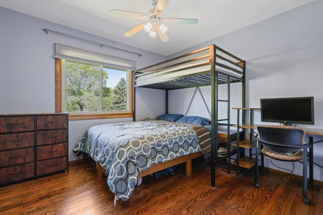 720 Tanglewood Dr, Shoreview, MN 55126 - bedroom with wood finished floors and ceiling fan