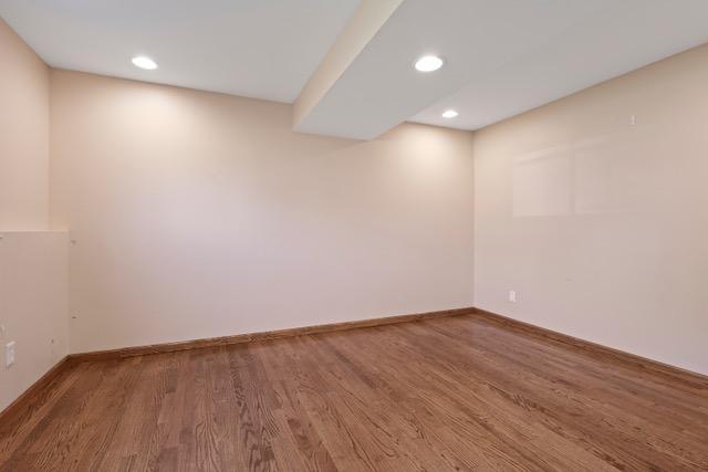 720 Tanglewood Dr, Shoreview, MN 55126 - empty room featuring wood finished floors, recessed lighting, and baseboards