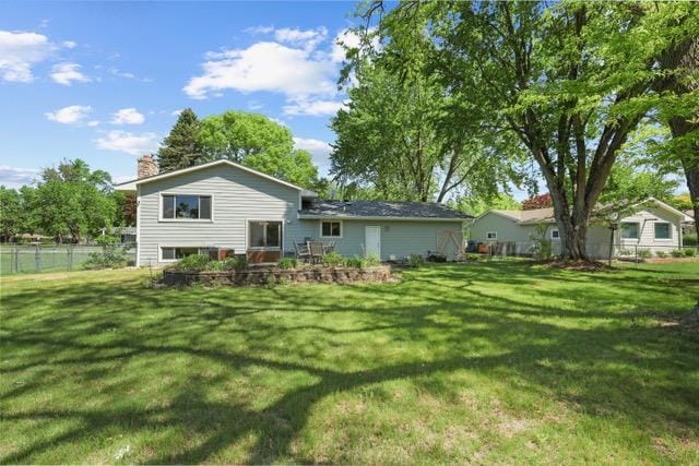 720 Tanglewood Dr, Shoreview, MN 55126 - back of property featuring a chimney