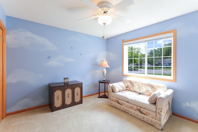9149 Farnsworth Ave N, Brooklyn Park, MN 55443 - sitting room with carpet flooring, baseboards, and a ceiling fan