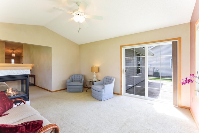 9149 Farnsworth Ave N, Brooklyn Park, MN 55443 - living room featuring carpet floors, baseboards, lofted ceiling, a ceiling fan, and a premium fireplace