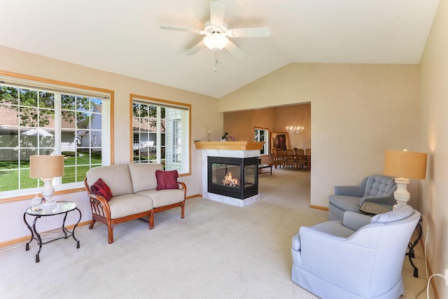 9149 Farnsworth Ave N, Brooklyn Park, MN 55443 - living room with carpet floors, lofted ceiling, baseboards, ceiling fan, and a fireplace