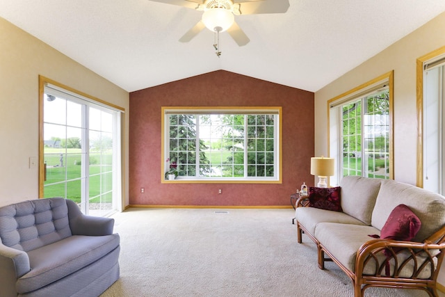 9149 Farnsworth Ave N, Brooklyn Park, MN 55443 - living room featuring vaulted ceiling, carpet floors, ceiling fan, and baseboards