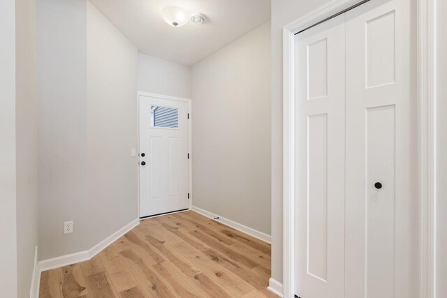 23221 Creekview Ct, Rogers, MN 55374 - entryway featuring light wood-style flooring and baseboards