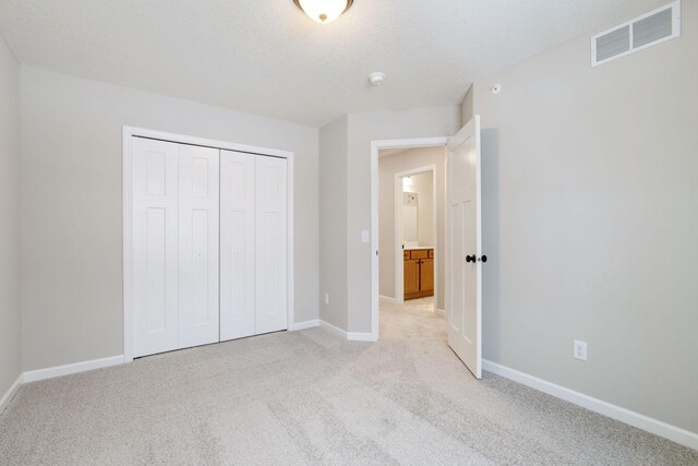 23221 Creekview Ct, Rogers, MN 55374 - unfurnished bedroom featuring light colored carpet, baseboards, and a closet