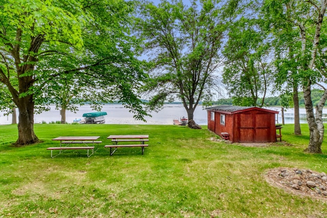 24505 Twilight Ln, Lida Twp, MN 56572 - view of grassy yard featuring a water view and a storage shed