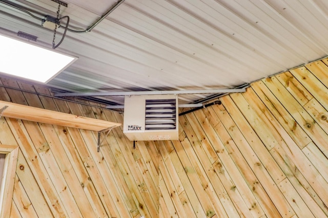 24505 Twilight Ln, Lida Twp, MN 56572 - garage view of wood walls and a heating unit