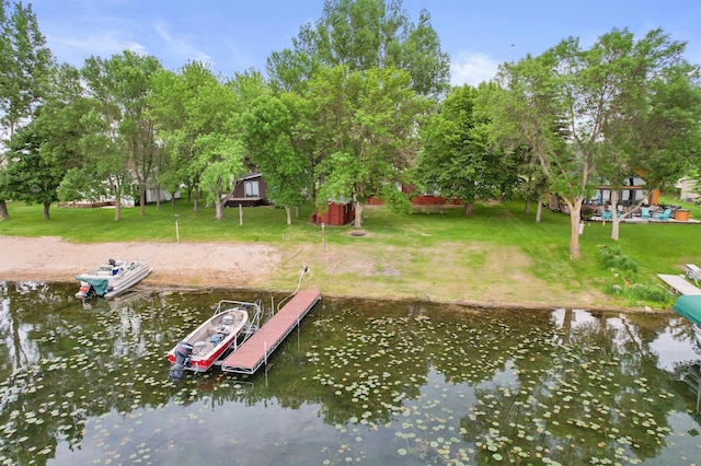 24505 Twilight Ln, Lida Twp, MN 56572 - dock area with a water view, a lawn, and view of scattered trees