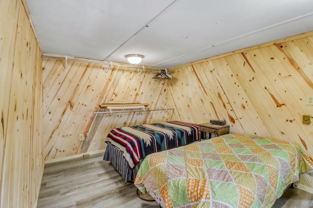24505 Twilight Ln, Lida Twp, MN 56572 - bedroom featuring wood walls and wood finished floors