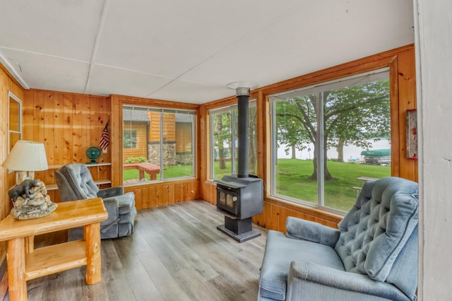24505 Twilight Ln, Lida Twp, MN 56572 - sunroom with plenty of natural light and a wood stove