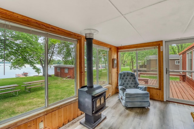 24505 Twilight Ln, Lida Twp, MN 56572 - sunroom / solarium with a wood stove