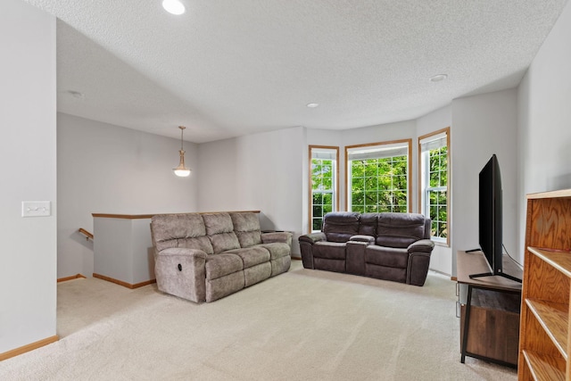 4107 Regent Ave N, Robbinsdale, MN 55422 - carpeted living room with a textured ceiling, recessed lighting, and baseboards